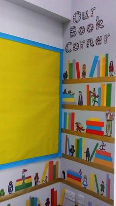 the children's room is decorated with colorful bookshelves and wall stickers