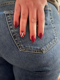 bow 2024 aesthetic nails red almond women jeans winter NYC Cool Girl Nails Aesthetic, Simple Christmas Nails Simple, Cute Nail Designs Coquette, Cute Winter Nail Ideas Simple, Cute Almond Nails Christmas, Red Nails Coffin Shape, Bowtie Nails, Christmas Nails Simple Design, Christmas Nails Not Red