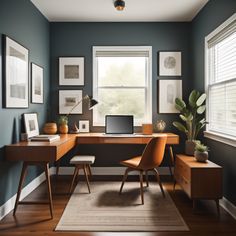 a home office with blue walls and wooden desks, framed pictures on the wall