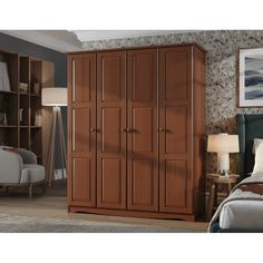 a bedroom scene with focus on the armoire and bed