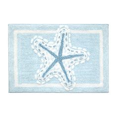 a blue and white rug with a starfish on it