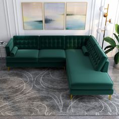 a green sectional couch sitting on top of a rug in front of a white wall