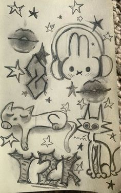 a drawing of some animals and stars on paper