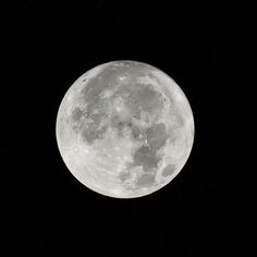 the full moon is seen in the dark sky