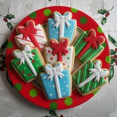 decorated christmas cookies on a red plate