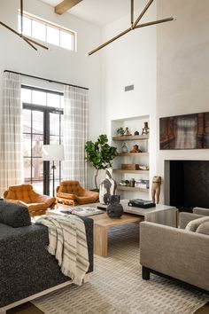 a living room filled with furniture and a fire place