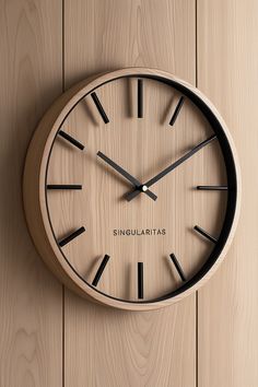 a wooden clock with black hands on a wall