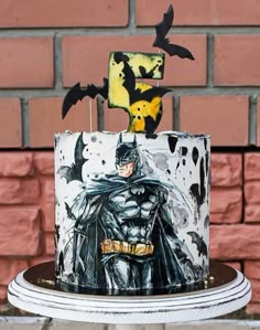 a batman themed birthday cake on a table