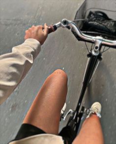 the legs of a person riding a bike