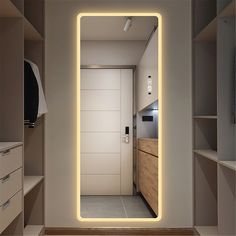 an illuminated mirror is in the middle of a room with white walls and flooring