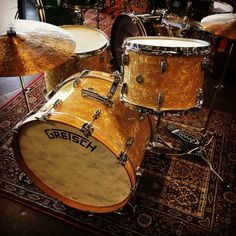 a drum set sitting on top of a rug