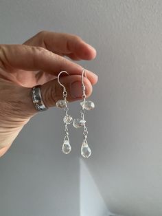 Exceptional pair of silver (sterling, 925) drop earrings, each with 3 faceted lime quartz teardrops, (length approx. 0.6 cm), which are carefully wound on silver wire. All silver parts are made of sterling silver (925). The earrings have a total length of approx. 5.5 cm. The ear hooks are 1.5 cm long, the pendants with the teardrops are 4 cm long. The pearls sparkle beautifully and the arrangement is exceptional. The drops are attached transversely, which results in the extraordinary design. The Namaste, Ear Hook, Silver Sterling, Silver Wire, Gift For Women, Everyday Outfits, Spice Things Up, Jewelry Earrings Dangle, Gifts For Women