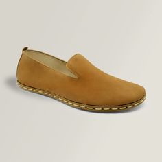 These Cinnamon Clays feature a matte, Nubuck leather that is soft and smooth. The beautiful tan color is a classic that goes well with everything. They feature a wide toe-box and zero-drop design to ensure a perfect, natural fit and a healthy gait. These classic grounding slip-ons are handmade with natural materials that only get better with time and wear. Stay grounded. Casual Brown Calf Leather Slip-ons, Classic Suede Slip-ons With Stitched Sole, Brown Suede Slip-ons With Leather Sole, Brown Swift Leather Slip-ons With Textured Sole, Brown Calf Leather Slip-ons With Plain Toe, Modern Brown Almond Toe Slip-ons, Everyday Classic Closed Toe Slip-ons, Brown Closed Toe Suede Loafers, Modern Brown Slip-ons With Stitched Sole