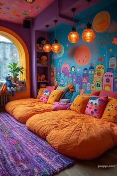 this bedroom is decorated in bright colors and has an orange comforter on the bed