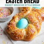 an easter bread with sprinkles and blue egg in the middle is shown