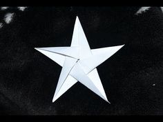 an origami star on a black background