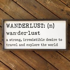 a sign that is on the side of a wooden wall saying wanderlust n