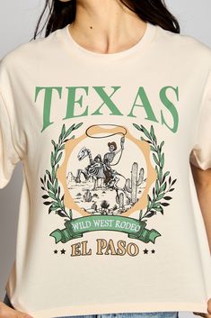 This Texas Wild West Rodeo tee has serious swagger! Featuring "TEXAS WILD WEST RODEO" print and an embroidered short sleeve crop top, this bad boy will make you the envy of the honky tonks! Saddle up and get ready to ride in style! 🤠 100% Cotton Dc Boots, Texas Christmas, Texas Shirts, Short Sleeve Crop Top, Embroidered Shorts, Short Sleeve Cropped Top, Glitz And Glam, Plus Dresses, Bad Boy