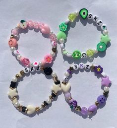 three bracelets with different designs on them