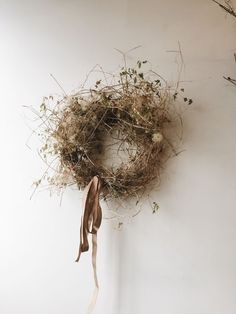 a dried wreath hanging on the wall