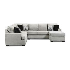 a large sectional couch with pillows on the top and bottom corner, in grey fabric