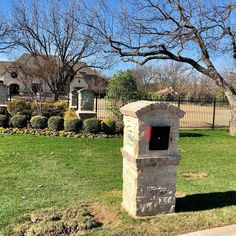 a mailbox in the middle of a yard