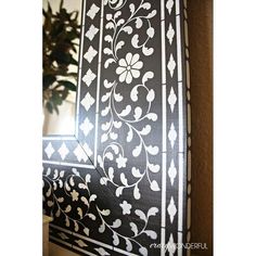 the window is decorated with black and white designs