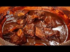 a close up of a bowl of food with meat