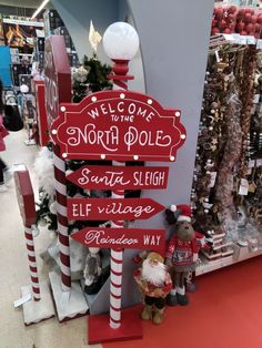 a sign that says welcome to north pole santa sleigh village