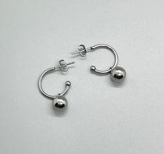 Hypoallergenic Non Tarnish Removable Stainless Steel Bead Hoop Earrings ~ Small Hoops ~ Silver Hoops ~ Women ~ Teens ~ Silver Ball Bead Charm ~ Gift For Her ~ Fun Fashion On The Go * 316L surgical stainless steel (hoops);  304 stainless steel (ball beads) * Measures:  approx 1"  * Hoop:  16mm  * Ball Bead:  8mm * Post w/butterfly backs * Tarnish resistant; waterproof * Easily remove ball beads to wear hoops alone! * Sold as pair MATCHING NECKLACE:   https://www.etsy.com/listing/1510581053/stainl Earrings Small Hoops, Hoops Silver, Silver Bead Necklace, Matching Bracelet, Bead Chain, Ball Pendant, Earrings Small, Beaded Hoop Earrings, Beaded Hoops