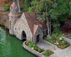 an aerial view of a house on the water