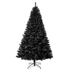 a black and white photo of a christmas tree with an ornament on top