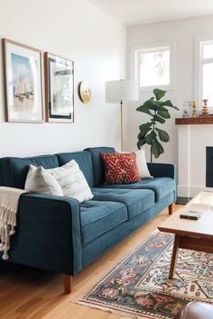 a living room filled with furniture and a fire place