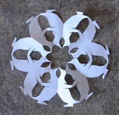 cut out paper flowers sitting on the ground