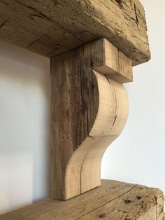 a wooden shelf with some wood carvings on it