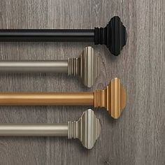 three different types of handles and knobs on a wooden surface