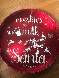 a red plate that says cookies and milk for santa