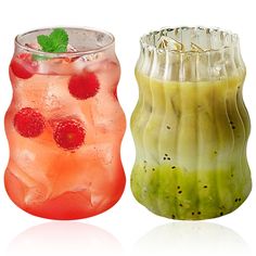 there are two different types of drinks in the same vases each one has strawberries and lime