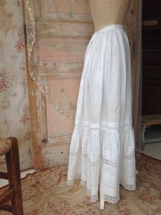 pure linen petticoat skirt with lace flounce made in the 1910s this is a very strong petticoat with pin tuck work and bobbin lace there is room to make the skirt 5 cm longer ( 2") waist 60 cm  23,5" length  94 cm  37" there is an era with some discoloration 19th Century Petticoat Pattern, Couture, Foundation Skirt, Winnie Foster, Petticoat Pattern, Vintage Style Aprons, Petticoat Skirt, Forest Witch, Lace Halter Top