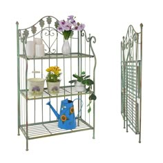 two metal shelves with flowers and watering tools