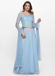 This charismatic blue lehenga set with embroidered net kalidaar skirt comes with V neck thread and sequins embroidered crop top. The look is completed with a blue net dupatta accentuated with border. Fancy Gowns, Blue Lehenga, Embroidered Crop Tops, Net Lehenga, Skirt Trends, Crop Top Skirt