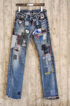 an old pair of jeans with patches on them