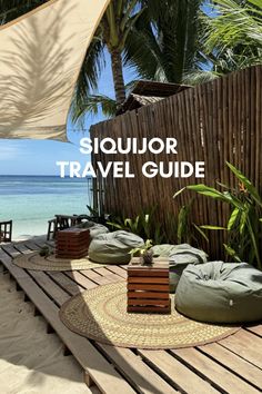 an outdoor area with chairs, tables and umbrellas on the beach that says siquitor travel guide