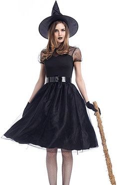 a woman in a witch costume holding a broom