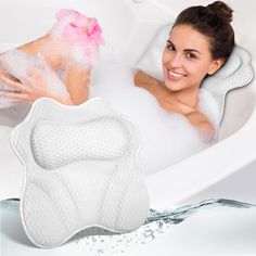 a woman in a bathtub with her hand on the back of an arm pillow