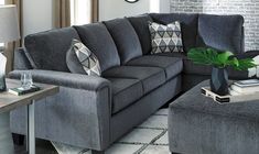 a living room filled with furniture and a clock on the wall