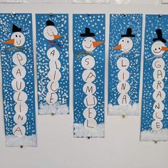 three snowmen made out of paper with words on them and the word's name spelled