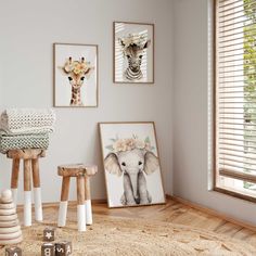 there are pictures on the wall and two stools in front of them, one with a giraffe