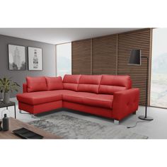 a living room with a red sectional couch