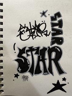 a spiral notebook with graffiti written on the front and back cover that says,'rap star '